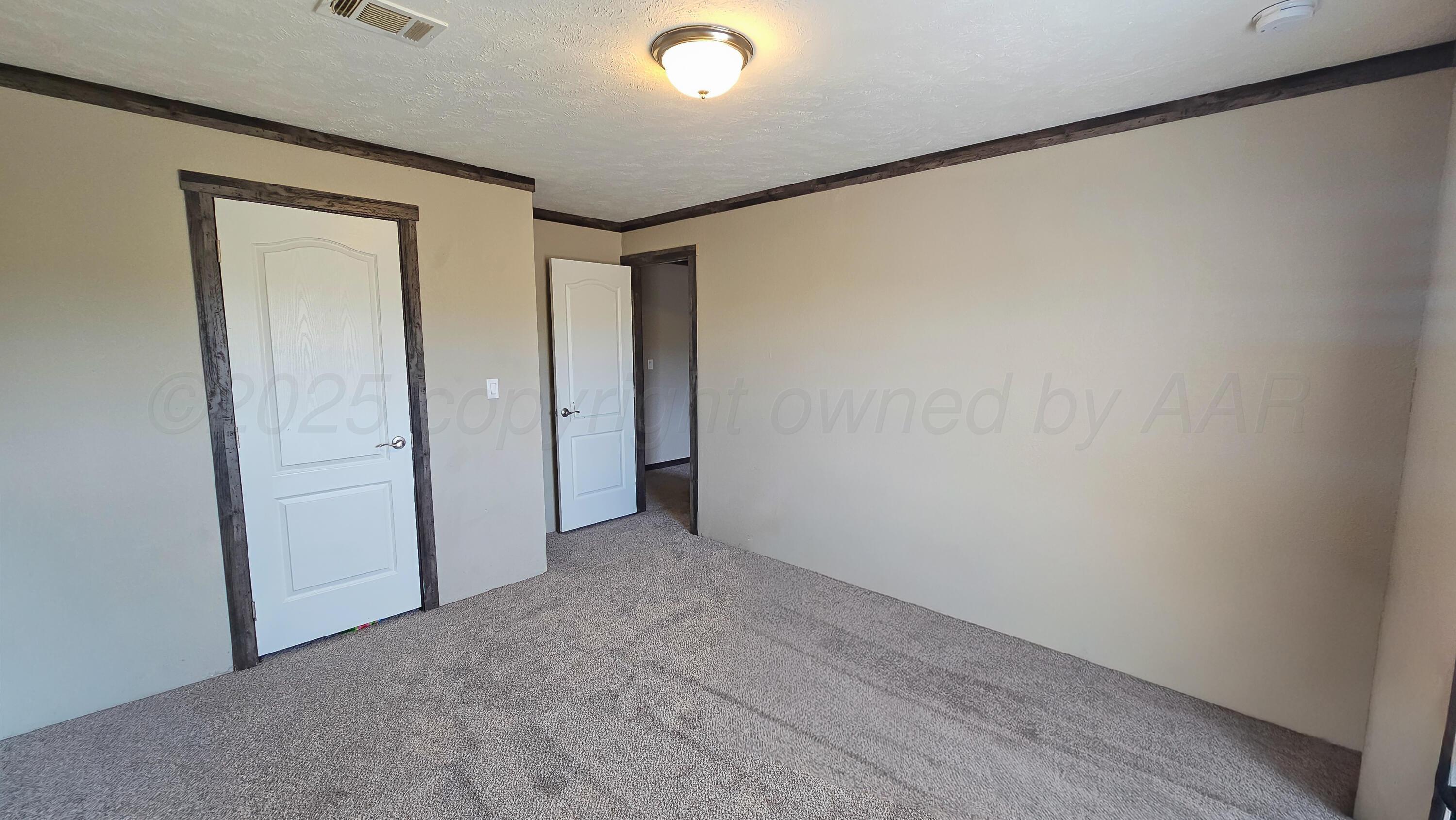 24490 RM 1061 Amarillo, TX 79124 - Photo 22 of 32 a view of hallway with closet