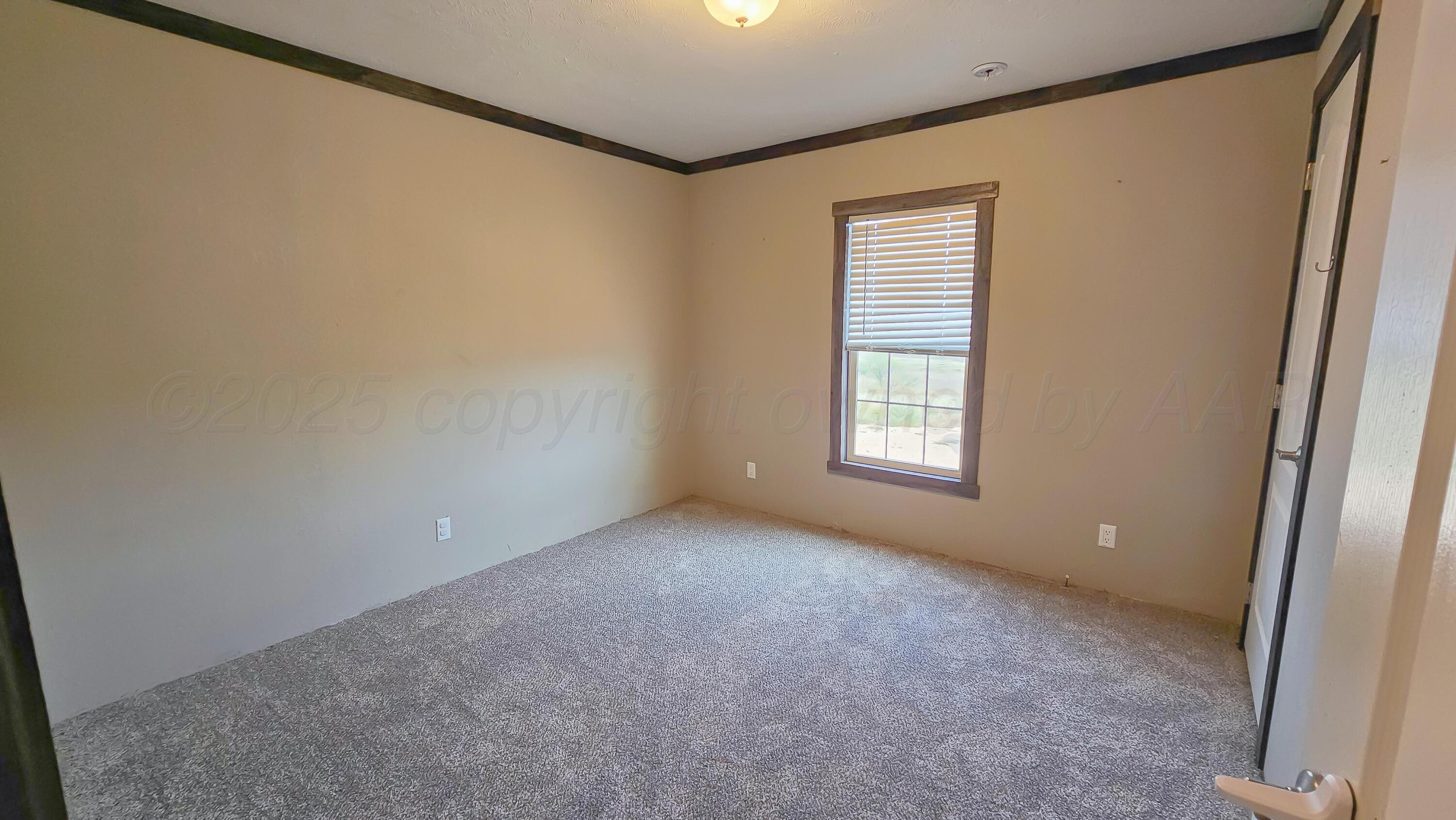 24490 RM 1061 Amarillo, TX 79124 - Photo 23 of 32 a view of an empty room with a window