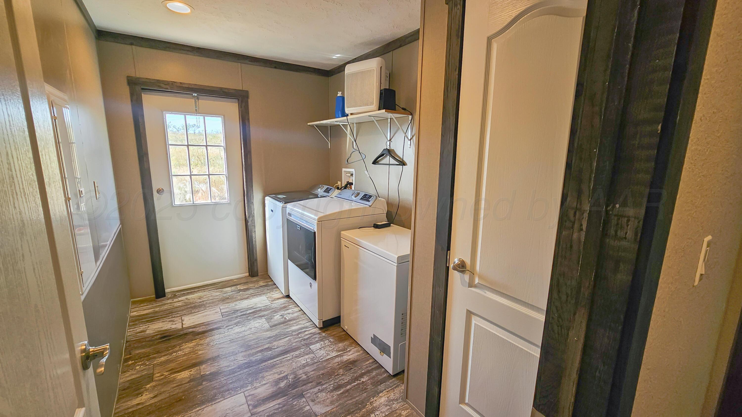 24490 RM 1061 Amarillo, TX 79124 - Photo 25 of 32 a room with a washer and dryer