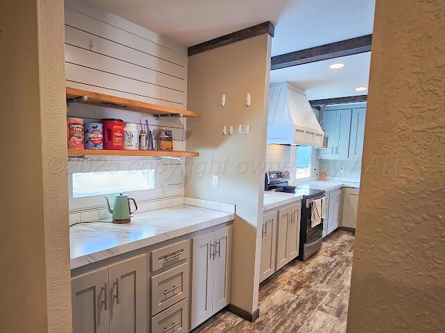 24490 RM 1061 Amarillo, TX 79124 - Photo 9 of 20 a kitchen with white cabinets and a sink