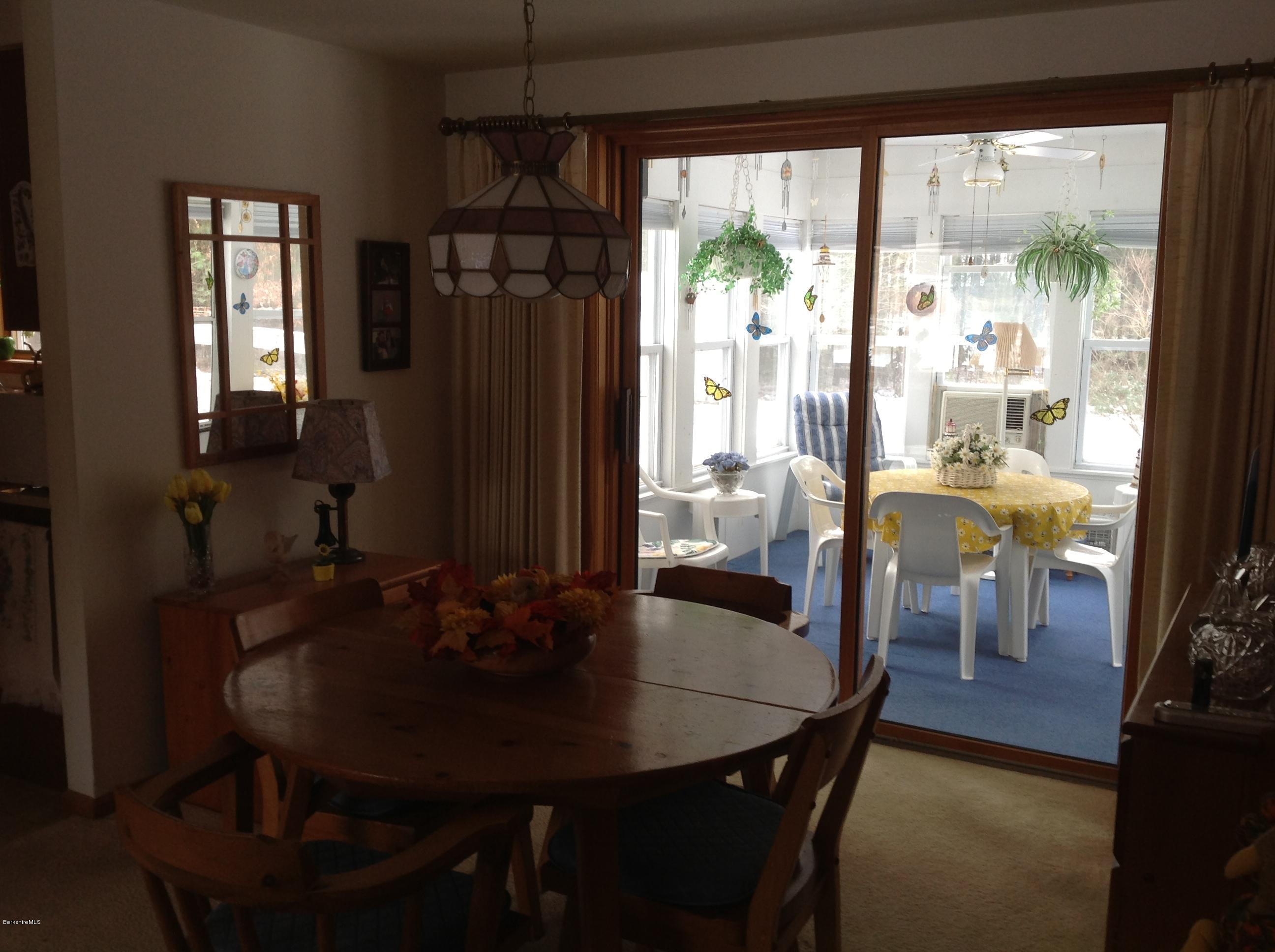 243 Bunce Road South Sheffield, MA 01222 - Photo 11 of 18 a view of a dining room with furniture window and outside view
