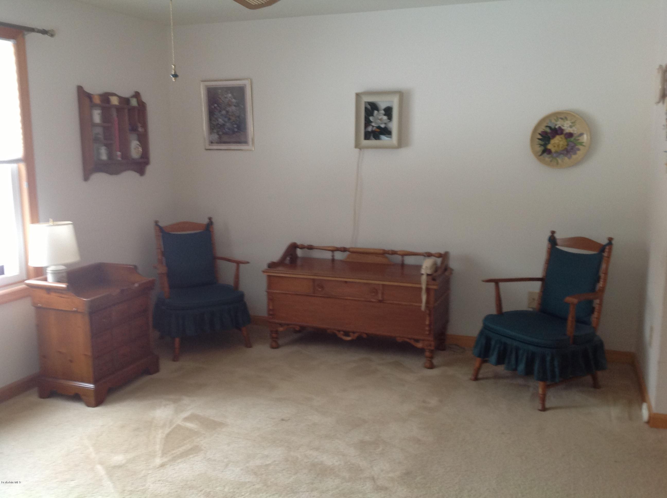 243 Bunce Road South Sheffield, MA 01222 - Photo 17 of 18 a room with furniture and a chair