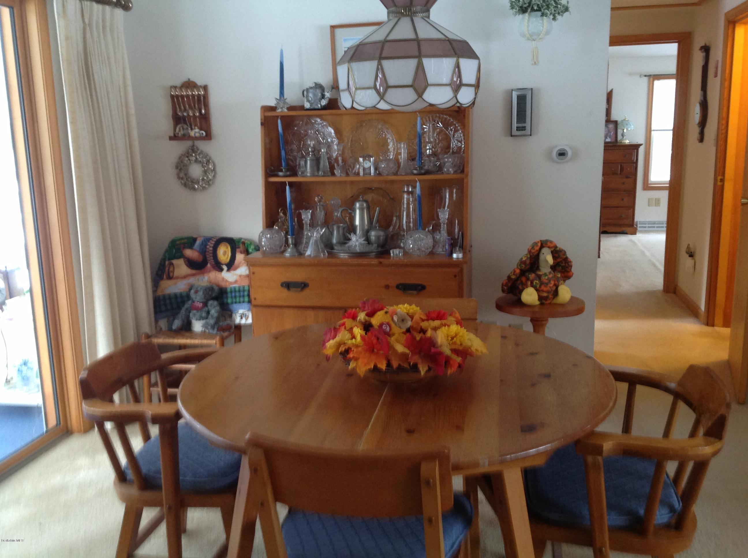 243 Bunce Road South Sheffield, MA 01222 - Photo 10 of 18 a view of a dining room with furniture and chandelier