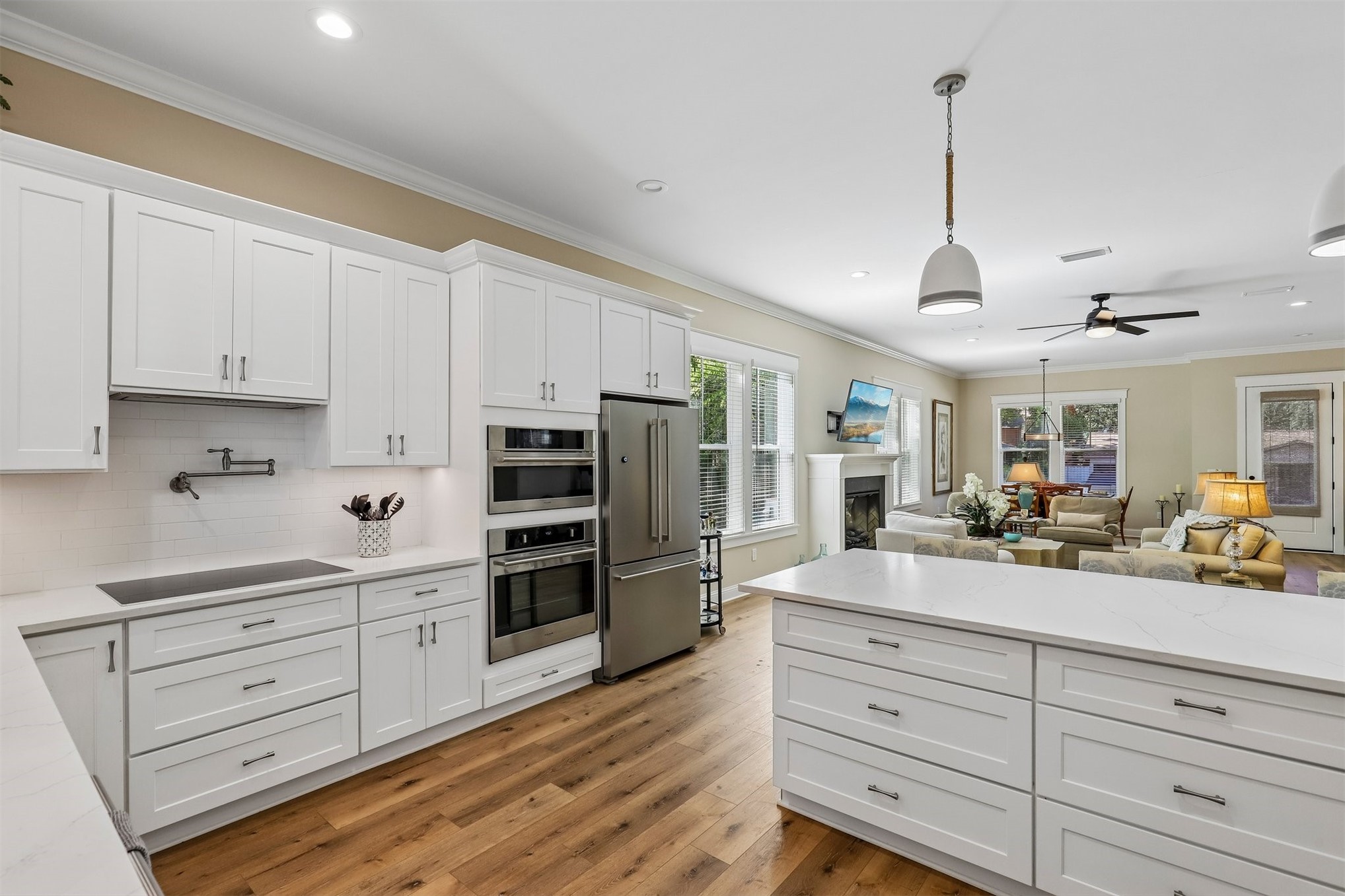 1012 White Street Fernandina Beach, FL 32034 - Photo 14 of 35 a kitchen with stainless steel appliances kitchen island granite countertop a refrigerator and cabinets