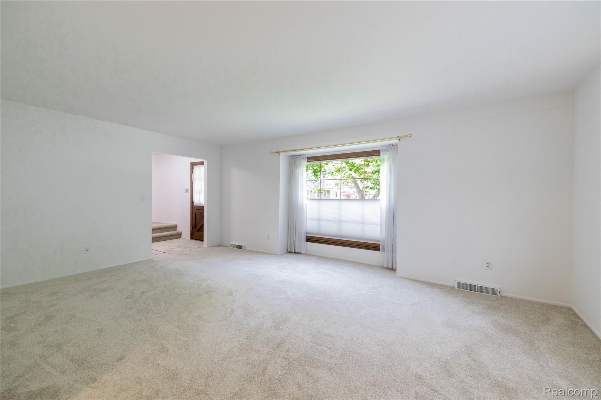 7611 Ferry Road Grosse Ile, MI 48138 - Photo 21 of 51 Spacious room featuring light-colored carpeting and white walls