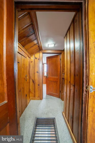 a view of an empty room with wooden walls
