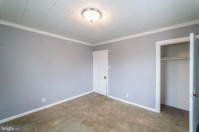 a kitchen with stainless steel appliances granite countertop a washer and dryer