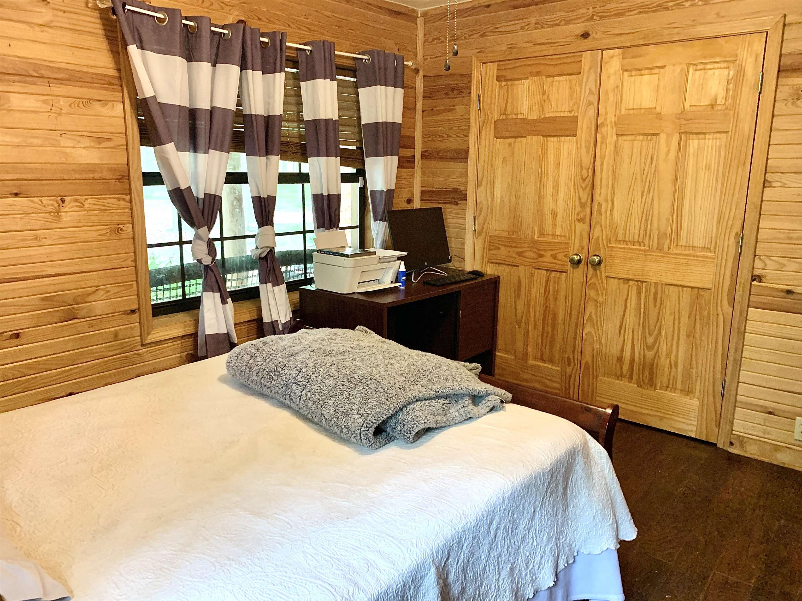 4560 Bishop Road Middleton, TN 38052 - Photo 32 of 40 Bedroom featuring wood walls and dark wood-style floors