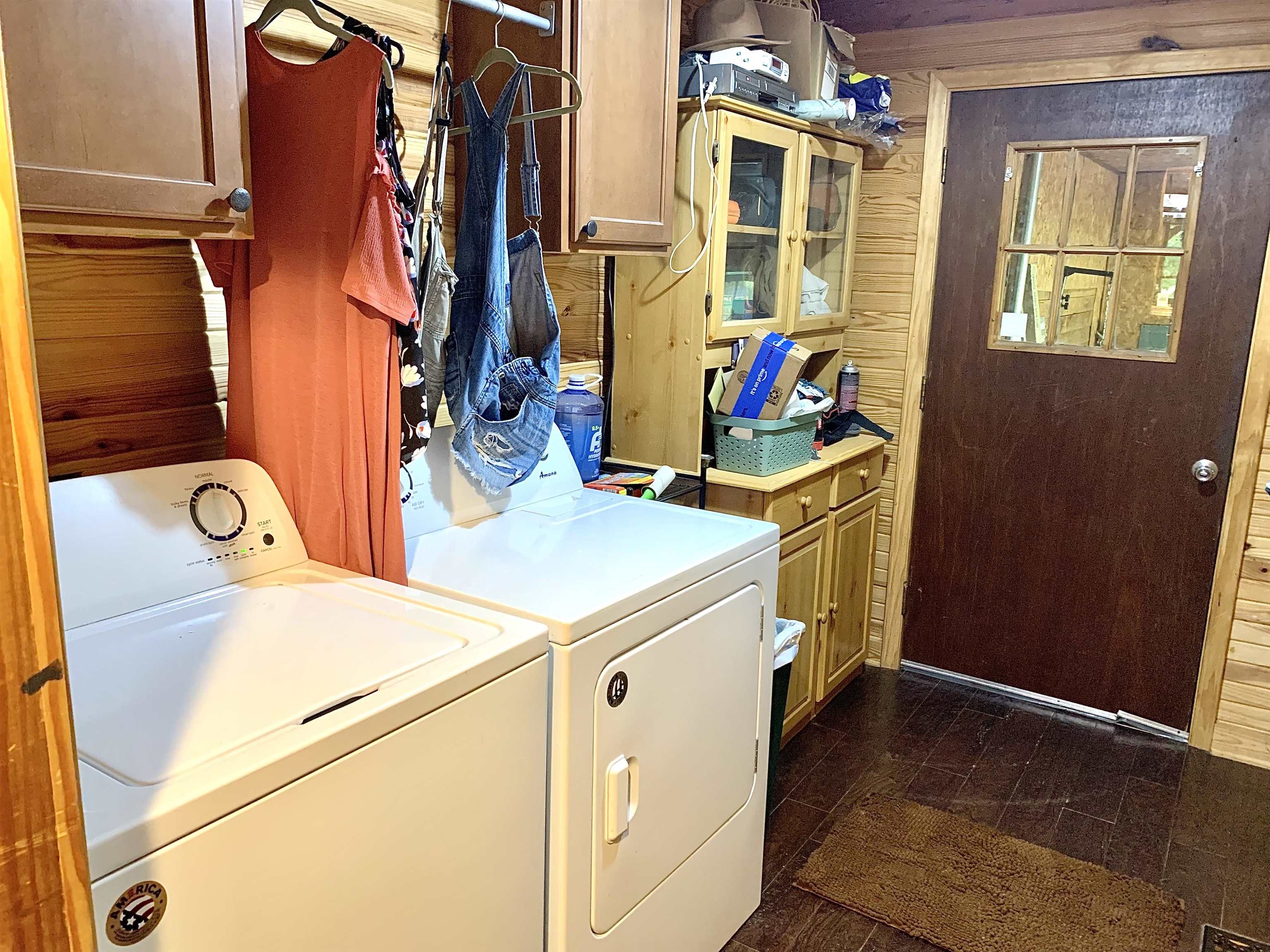 4560 Bishop Road Middleton, TN 38052 - Photo 33 of 40 Washroom with wooden walls, cabinet space, and washer and clothes dryer