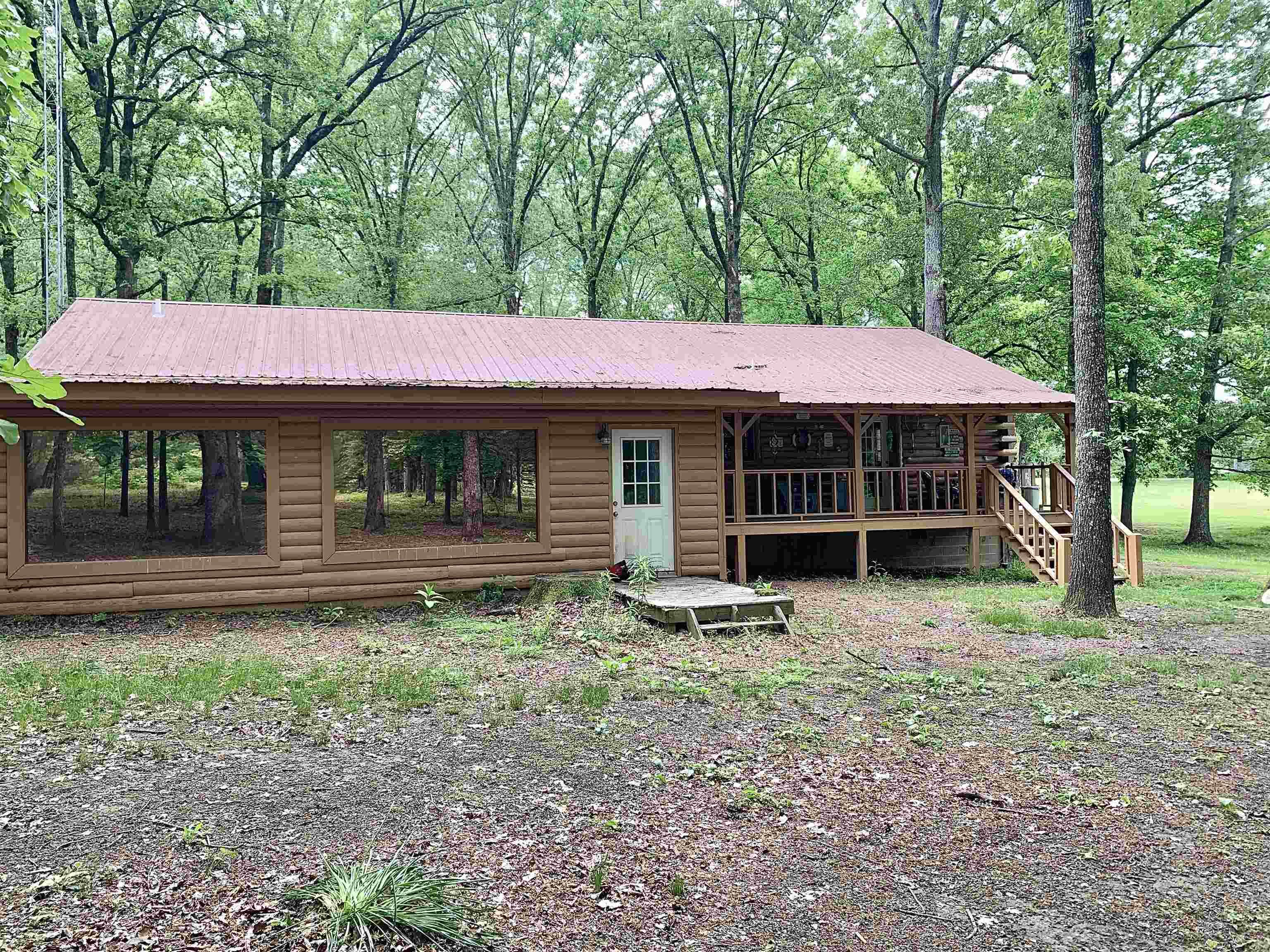 4560 Bishop Road Middleton, TN 38052 - Photo 5 of 40 View of front of property with covered porch, faux log siding, and metal roof