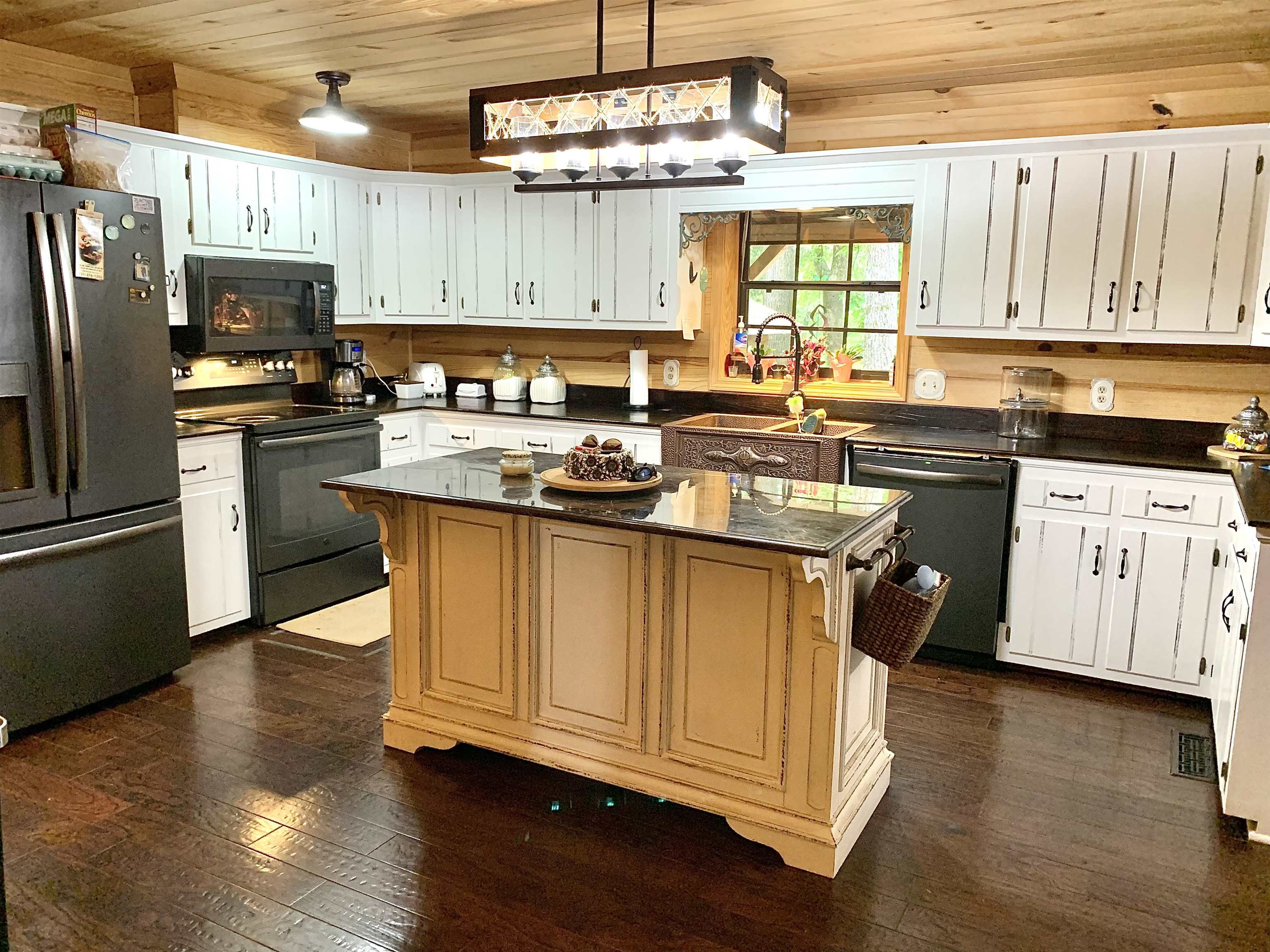 4560 Bishop Road Middleton, TN 38052 - Photo 8 of 40 Kitchen featuring a sink, dark countertops, dark wood-style flooring, and black appliances