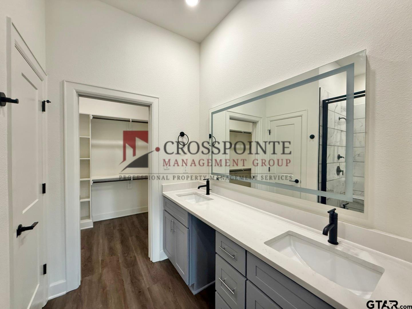 548 West Erwin Street Tyler, TX 75702 - Photo 18 of 27 a bathroom with a sink and a mirror