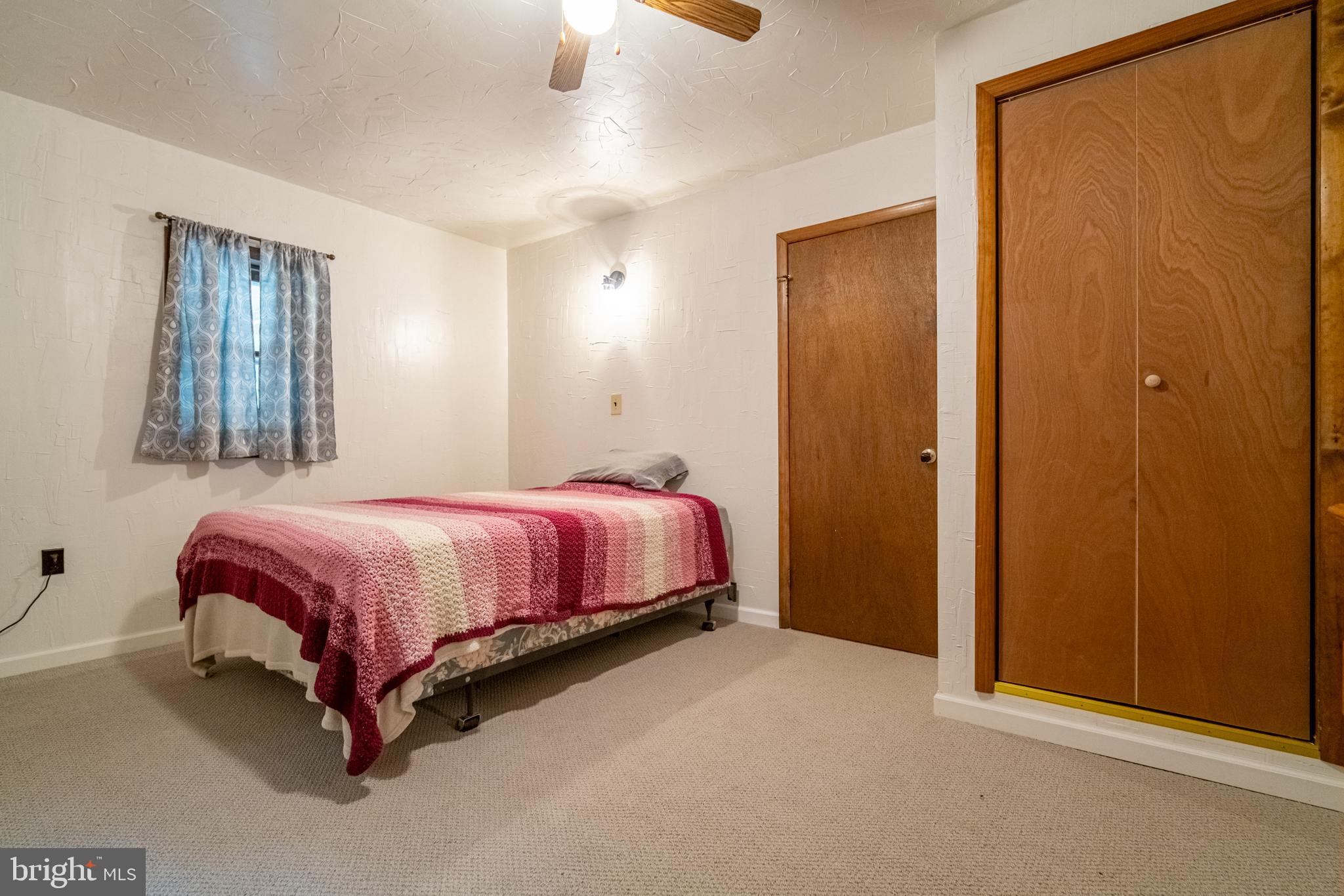 13127 Manor Furnace Road Brogue, PA 17309 - Photo 47 of 78 a bed room with a bed and a mirror