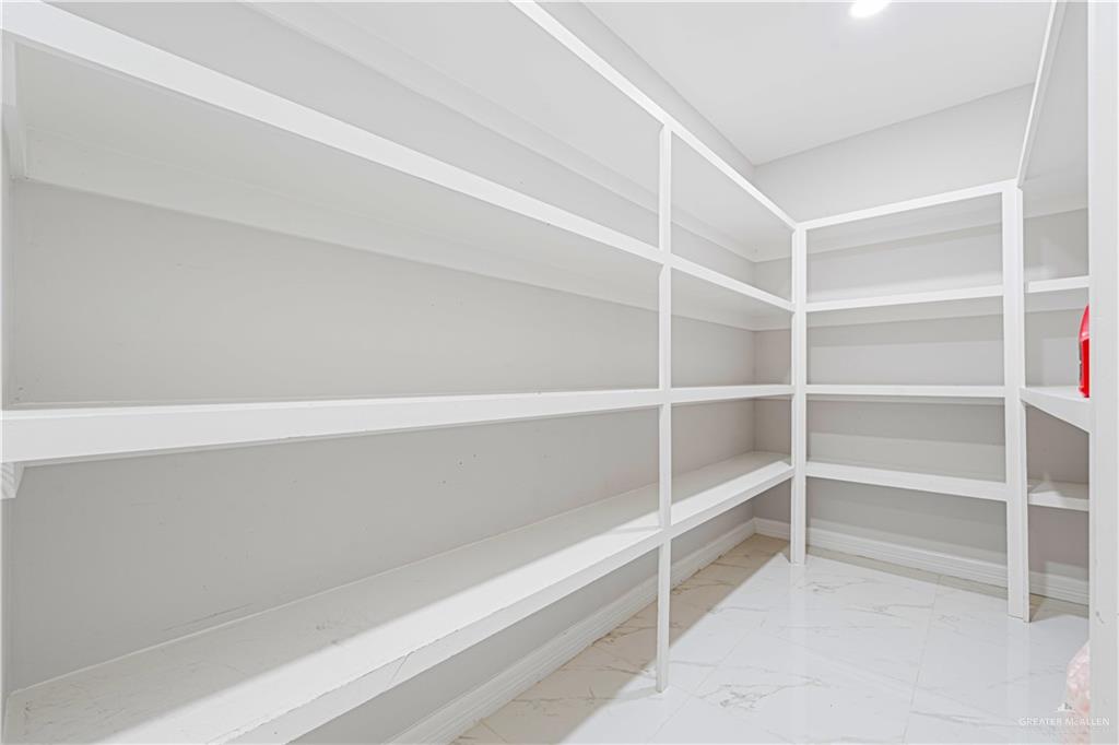 1208 Travis Street Mission, TX 78572 - Photo 11 of 41 a view of an empty walk in closet