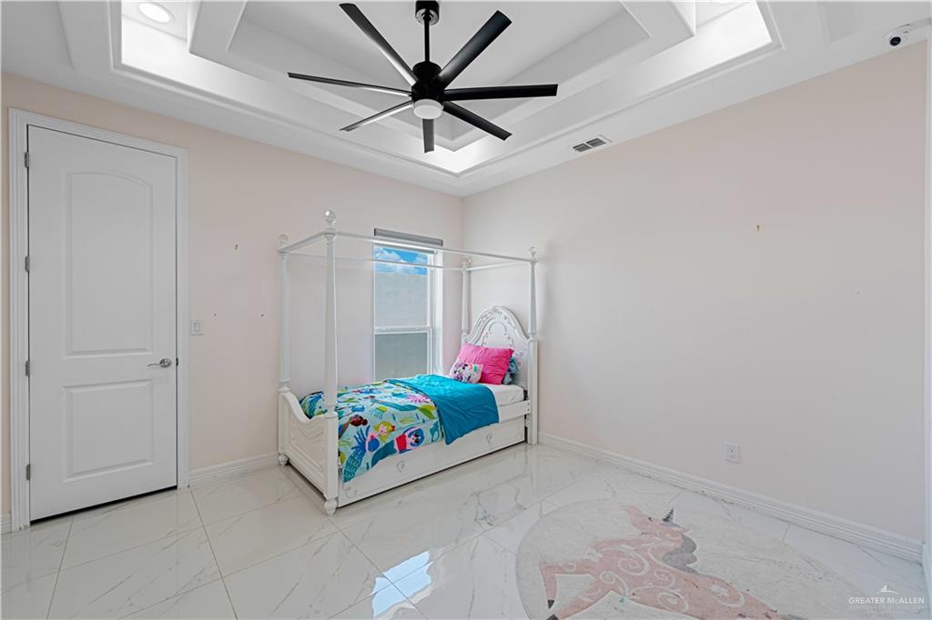 1208 Travis Street Mission, TX 78572 - Photo 15 of 41 a living room with hard wood floor and a ceiling fan