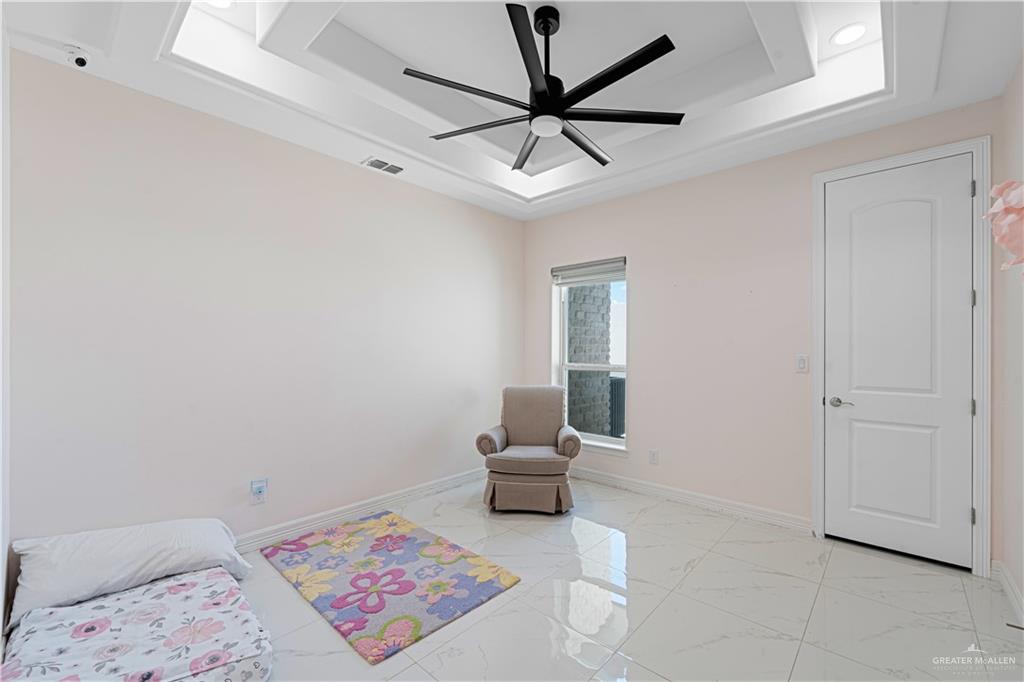1208 Travis Street Mission, TX 78572 - Photo 16 of 41 a living room with furniture and white walls