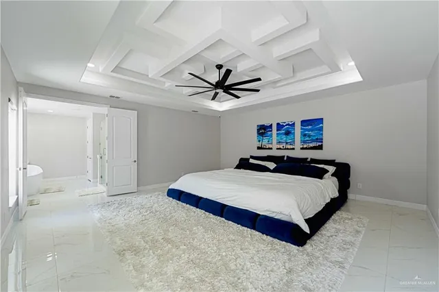 a room with a bed and ceiling fan