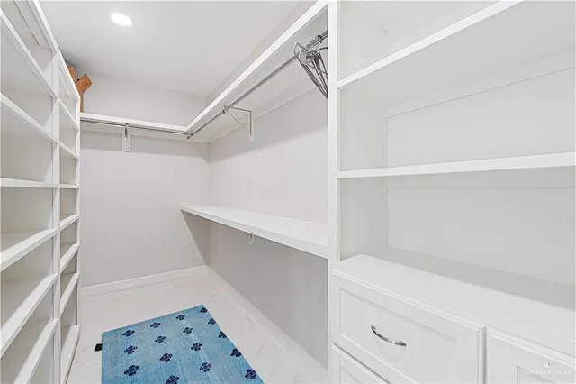 a view of an empty walk in closet