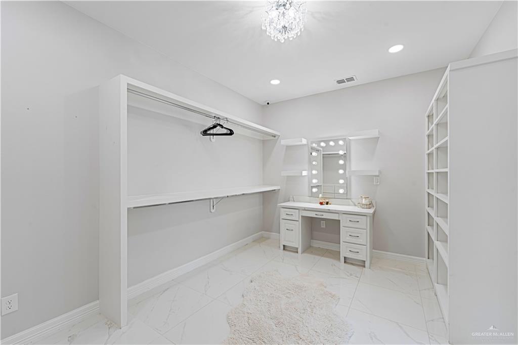 1208 Travis Street Mission, TX 78572 - Photo 22 of 41 a view of a bathroom with a sink and mirror