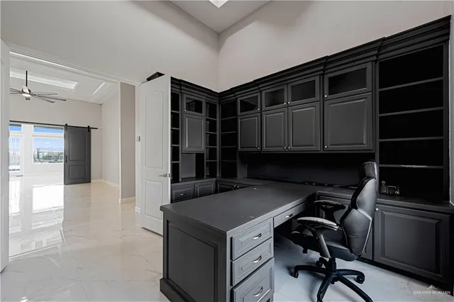 a kitchen with a refrigerator and a sink