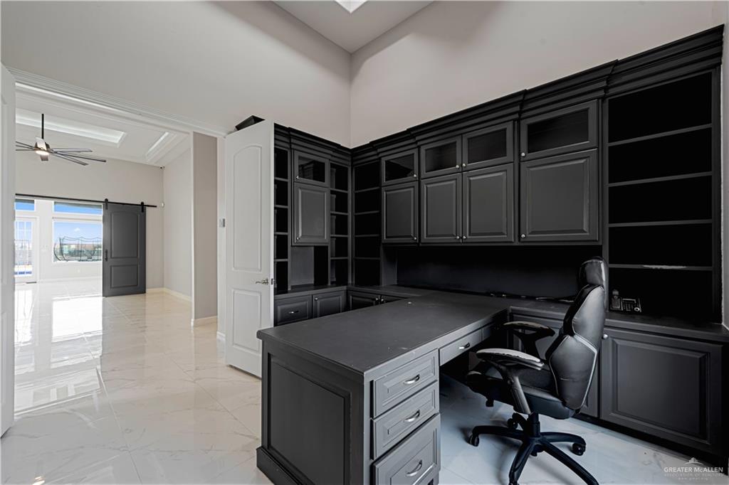 1208 Travis Street Mission, TX 78572 - Photo 7 of 41 a kitchen with a refrigerator and a sink
