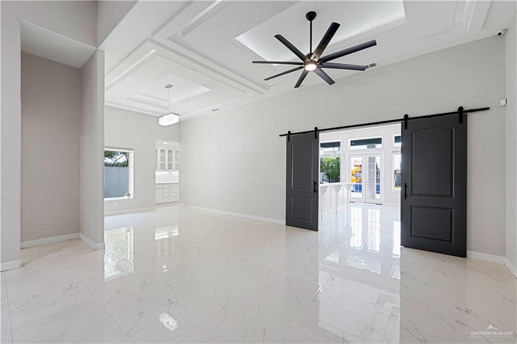 1208 Travis Street Mission, TX 78572 - Photo 8 of 41 a view of livingroom with hardwood floor and a ceiling fan