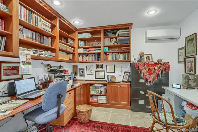 a work room with furniture and book shelf