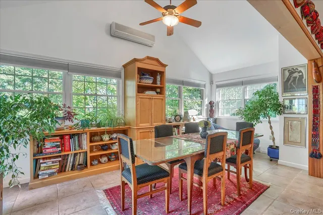 a view of a dining room with furniture window and outside view