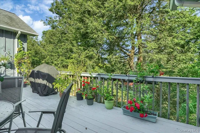 a view of a balcony with outdoor seating
