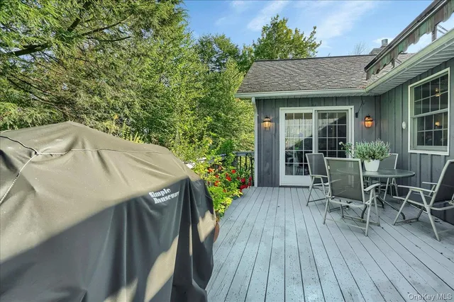 a view of a patio with table and chairs