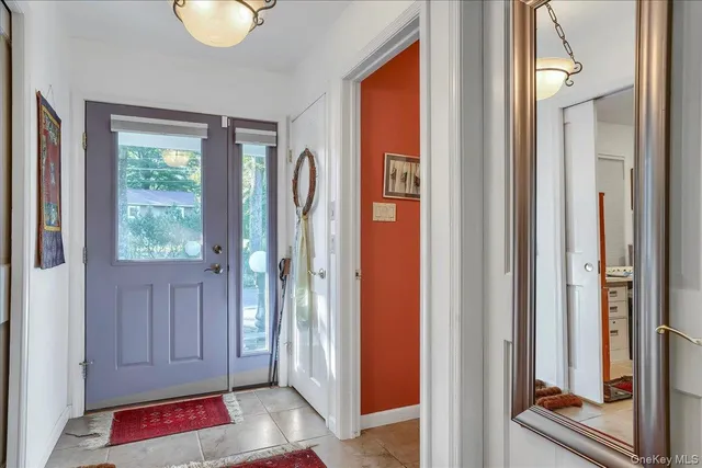 a view of front door with yard