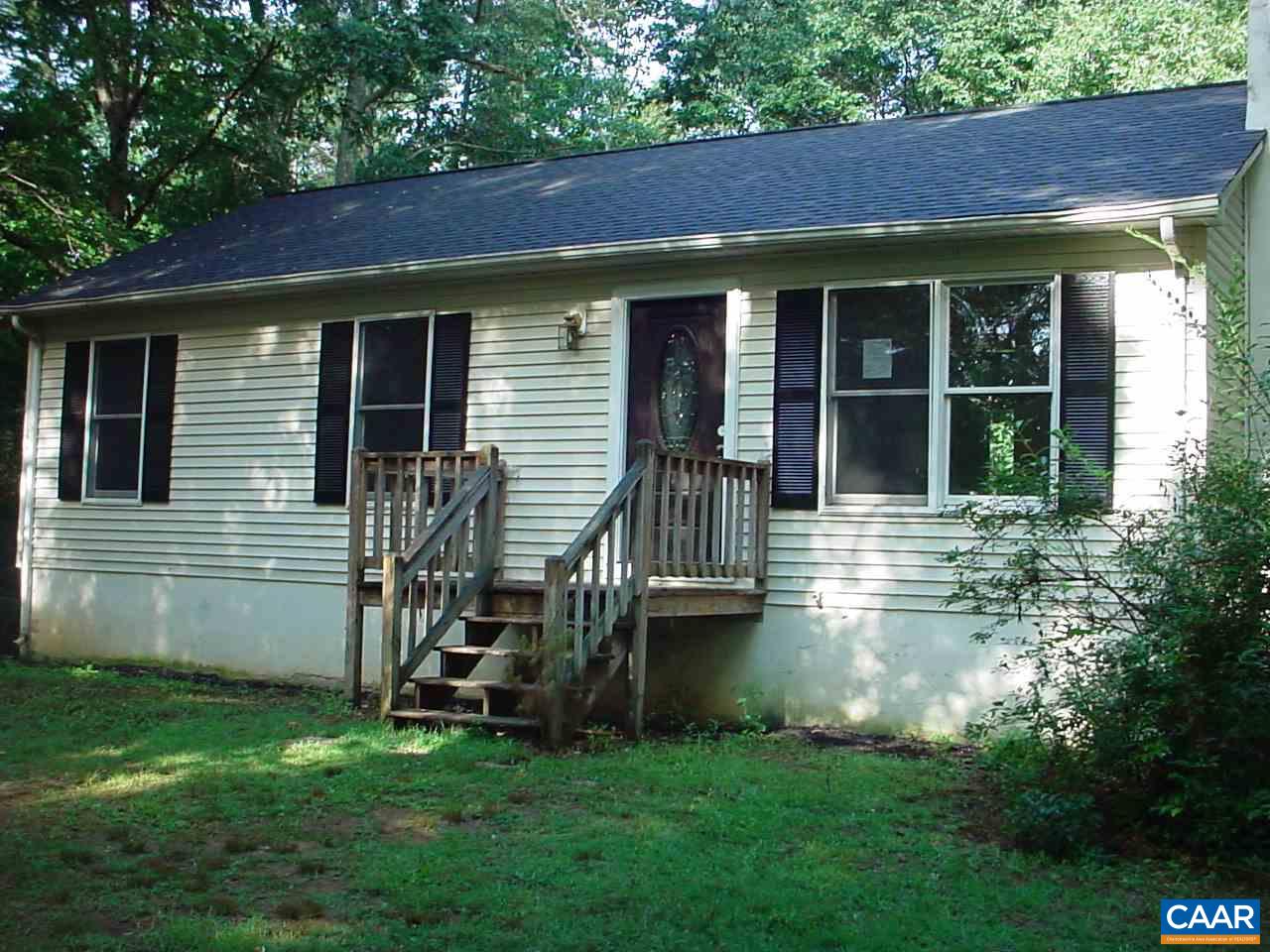 a view of a house with a yard porch and sitting area