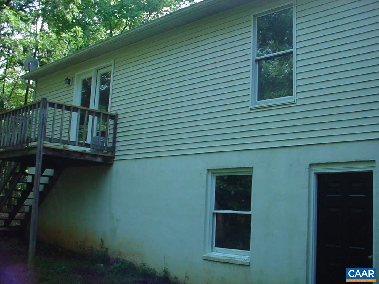 8006 Chestnut Grove Road Esmont, VA 22937 - Photo 2 of 9 a view of backyard of house and wooden deck