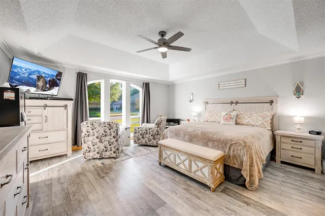 a spacious bedroom with a bed and a window