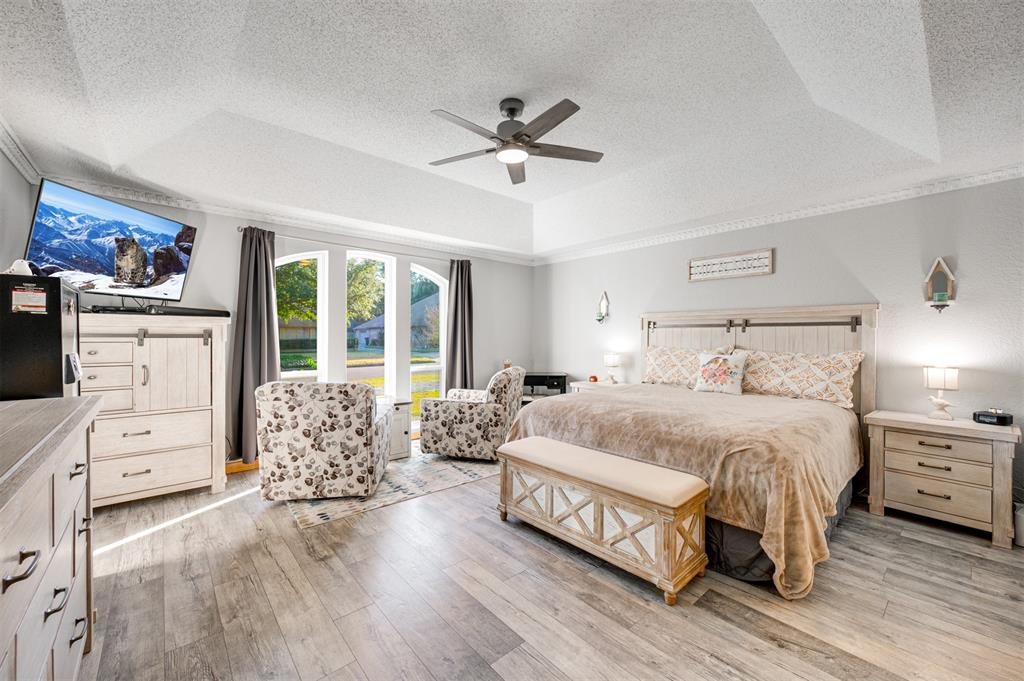 4115 Alpine Street Paris, TX 75462 - Photo 13 of 40 a spacious bedroom with a bed and a window