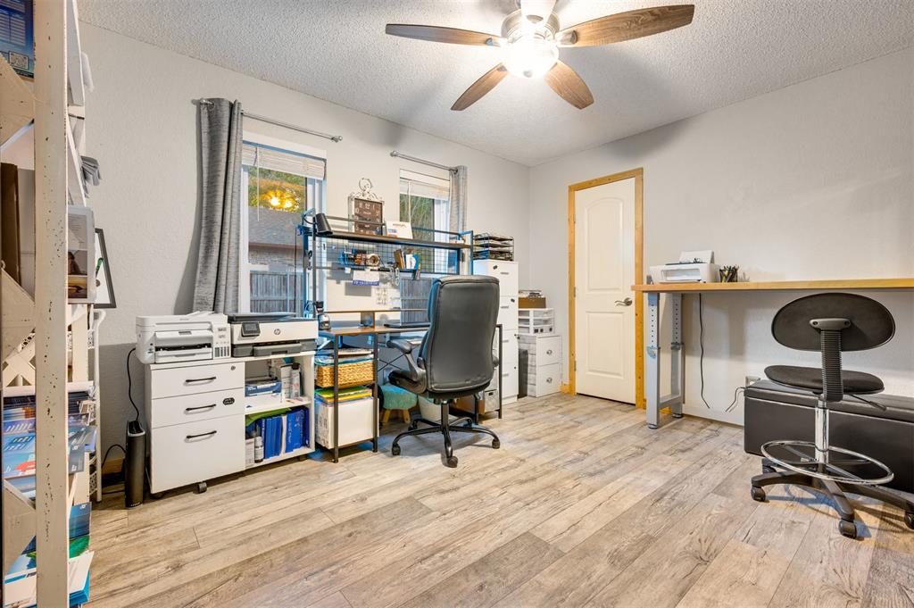 4115 Alpine Street Paris, TX 75462 - Photo 21 of 40 a view of a workspace with furniture and a window