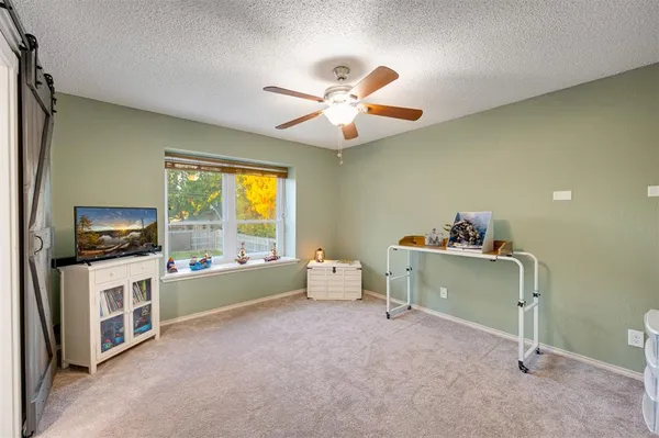 a room with furniture and a flat screen tv