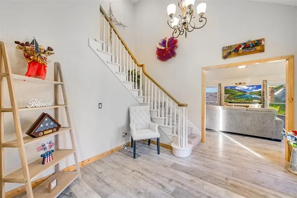 a view of entryway with wooden floor