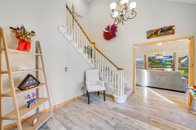 a view of entryway with wooden floor