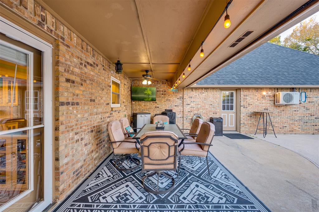 4115 Alpine Street Paris, TX 75462 - Photo 32 of 40 a balcony view with a table and chairs
