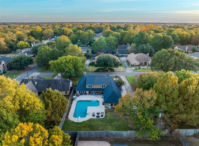 an aerial view of house with yard swimming pool and outdoor seating