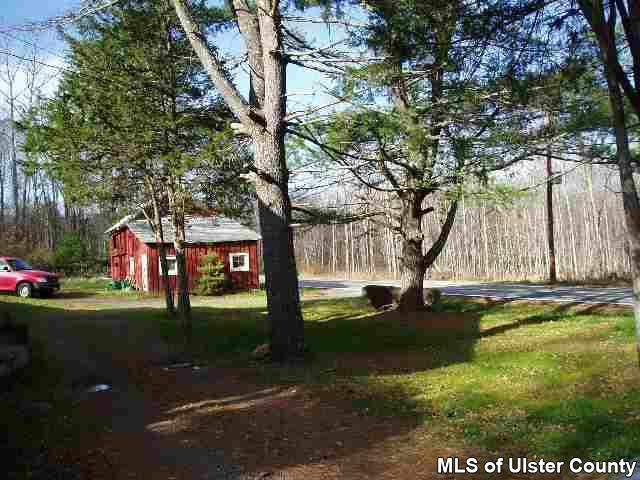 4543 Atwood Road Stone Ridge, NY 12484 - Photo 3 of 4 a front view of a house with garden
