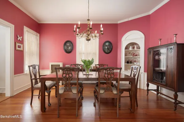 a view of a dining area with furniture and wooden floor
