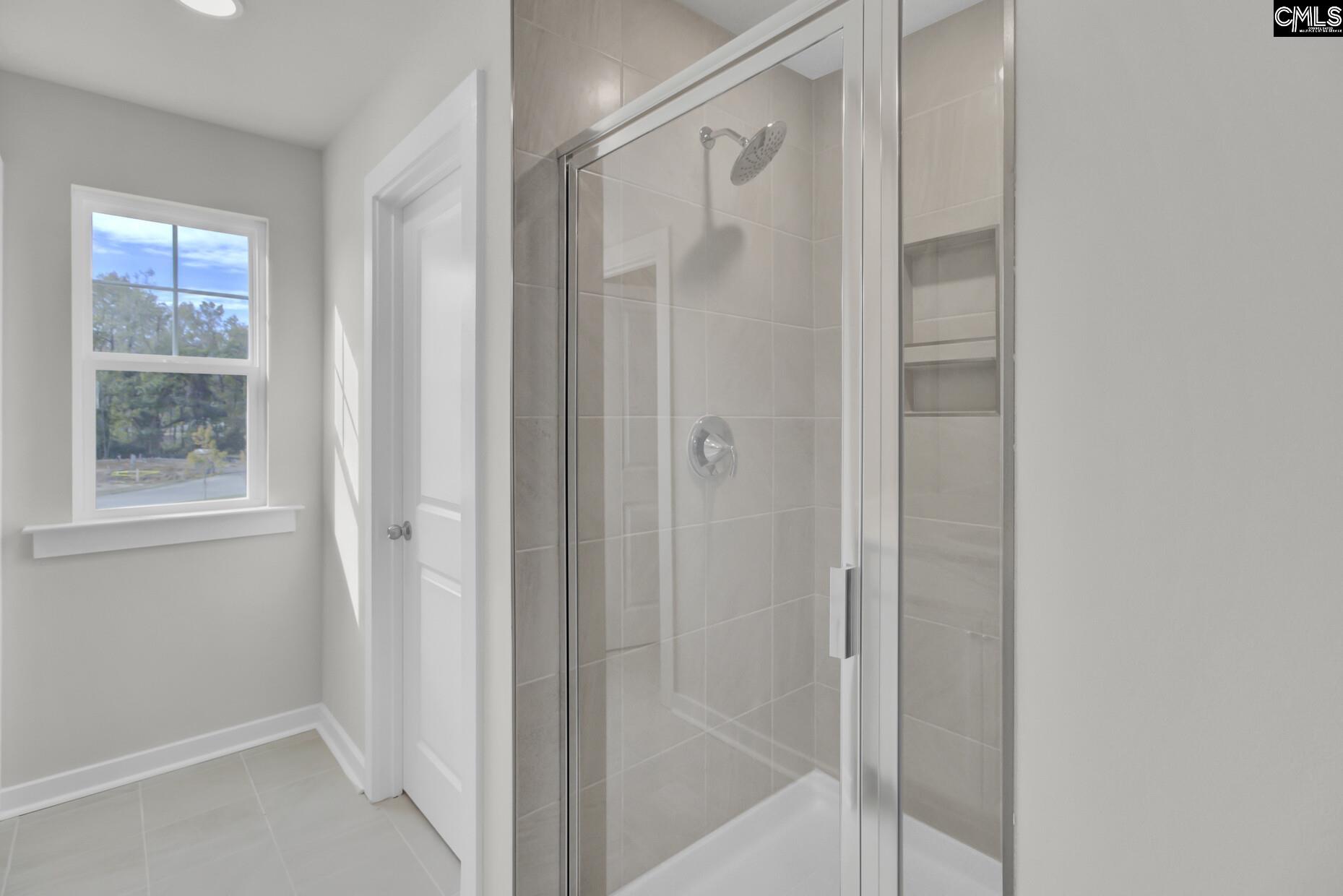 320 Brass Billion Path Lexington, SC 29073 - Photo 19 of 39 a bathroom with a glass shower door