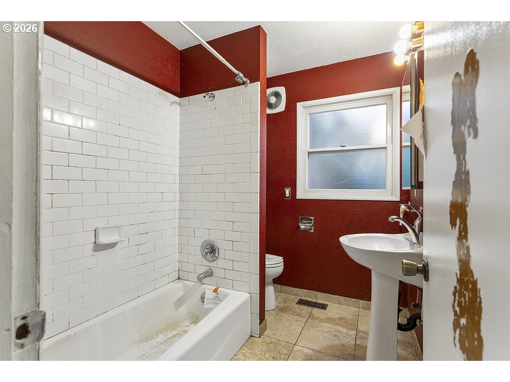 14035 Southeast Harrison Street Portland, OR 97233 - Photo 16 of 32 a bathroom with a sink and a mirror