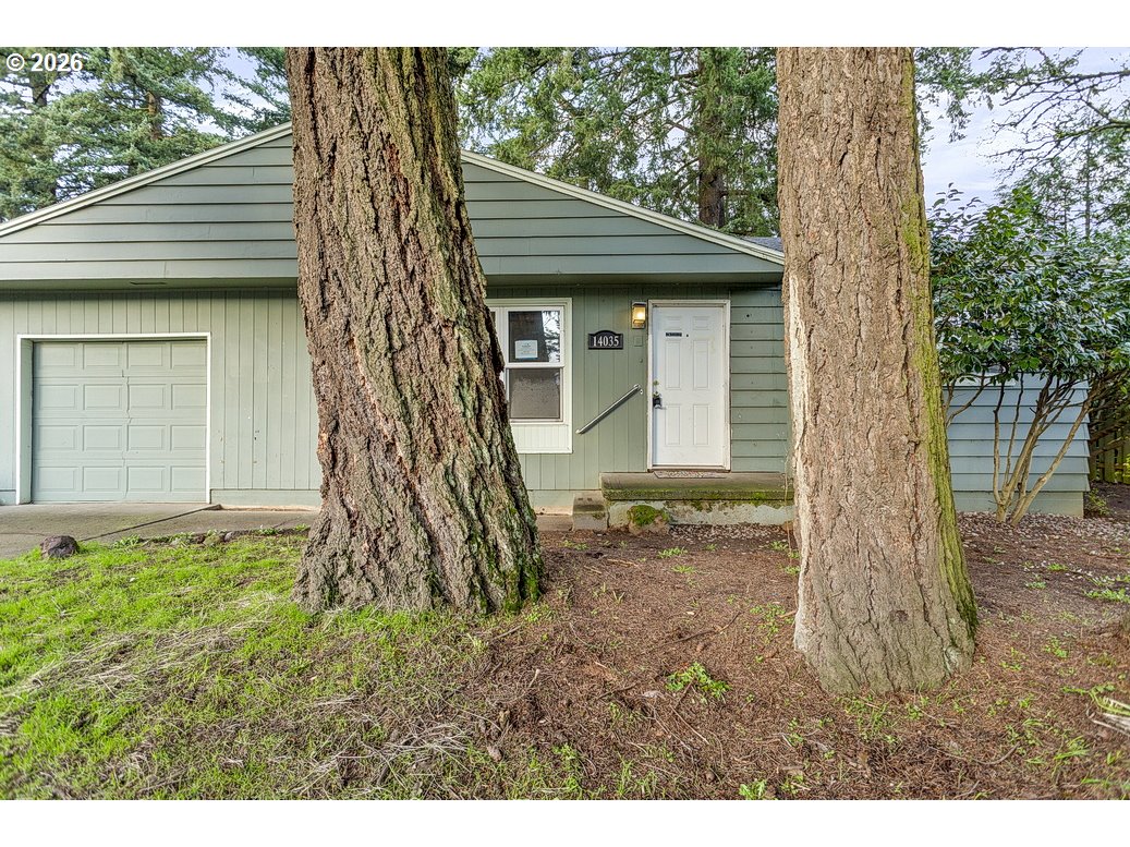 14035 Southeast Harrison Street Portland, OR 97233 - Photo 23 of 32 a view of a house with a tree in the yard