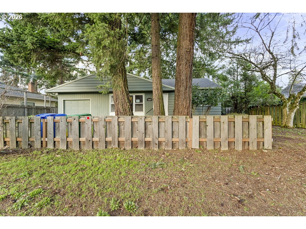 14035 Southeast Harrison Street Portland, OR 97233 - Photo 25 of 32 a front view of a house with a yard