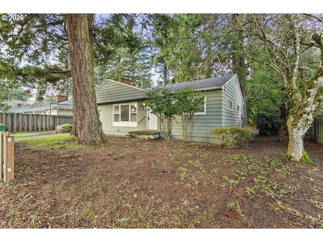 14035 Southeast Harrison Street Portland, OR 97233 - Photo 26 of 32 a backyard of a house with lots of green space