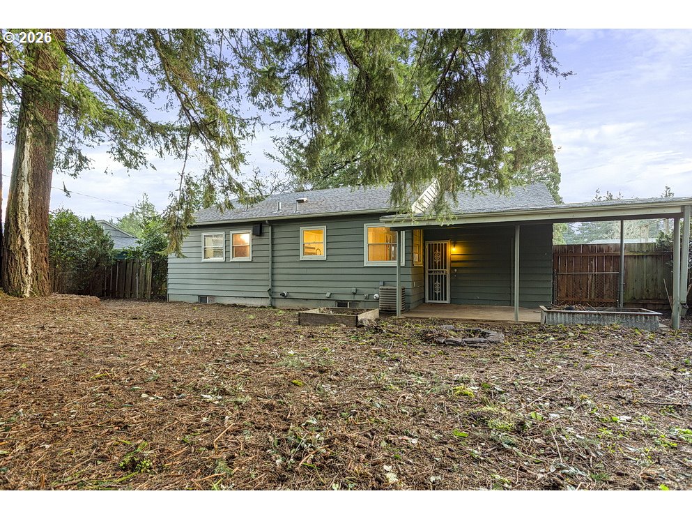 14035 Southeast Harrison Street Portland, OR 97233 - Photo 31 of 32 a front view of a house with garden