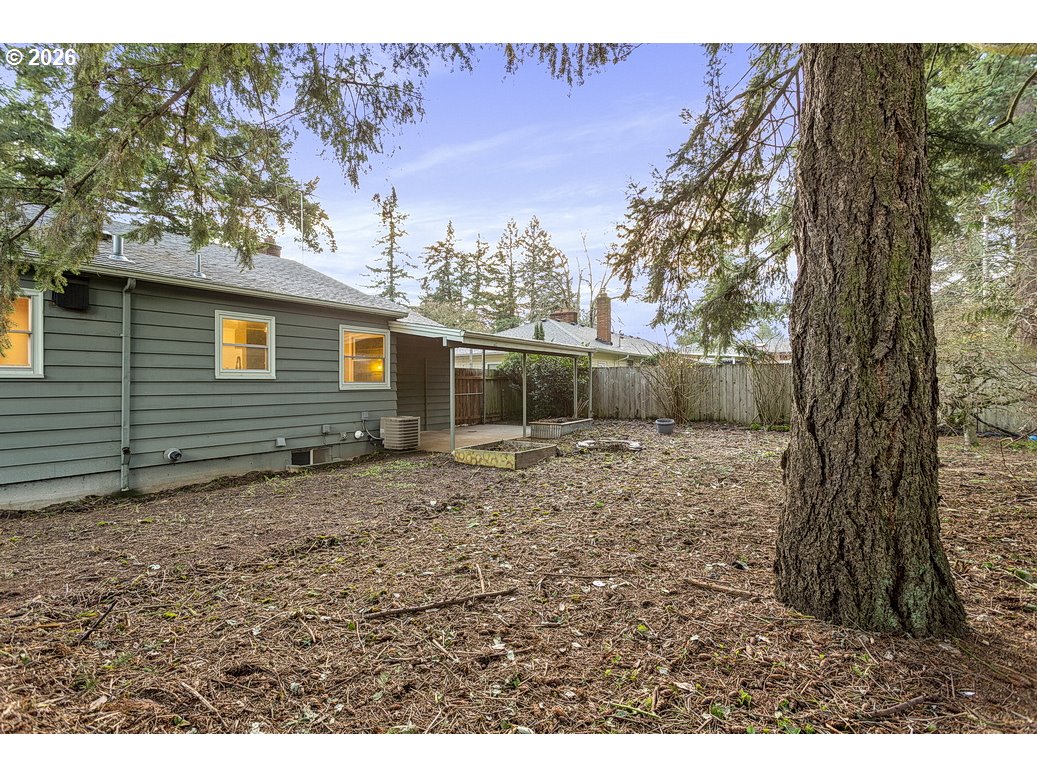 14035 Southeast Harrison Street Portland, OR 97233 - Photo 32 of 32 a backyard of a house with lots of green space
